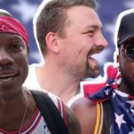 German FAN in Paris shows off the Cheryl Swoopes JERSEY he bought at ’96 Atlanta Olympics